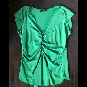 Ping short sleeve green top. Rouched center with stretch